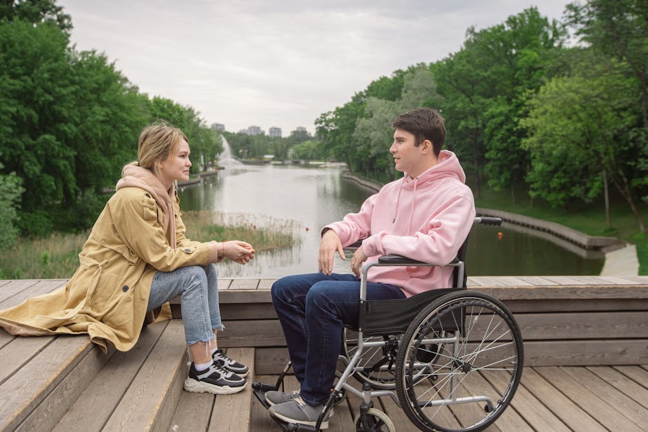 A couple enjoys time together by the river, highlighting love and support.